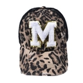 Detailed view of leopard print trucker hat featuring white towel-embroidered M and mesh back - Letter M (Black Leopard)