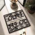 Square non-slip bathroom mat with black floral rose pattern and happiness quote - White Rose Delight