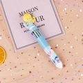Cute light blue mermaid multi-color ballpoint pen with character topper on pink background - Blue Mermaid