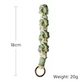 Handmade woven daisy keychain in green and white colors with gold ring, 18cm long - Light Green & White