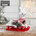 Christmas reindeer on red wooden sleigh with pine cones and white flocked finish - Sled Reindeer Style