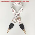 Detail of adjustable bag strap with colorful hot air balloon print and gold metal hook - Hot Air Balloon Black Leather Gold Hook