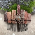 Detail of handmade hair comb with pink crystals, silver sun pendant and black metal teeth - Strawberry Quartz Black Wire Silver Sun