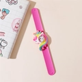 Detail of pink silicone slap watch featuring a cute 3D unicorn and clear numeric dial - Hot Pink
