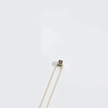 Minimalist gold necklace with a creative black cube pendant featuring capital letter D - Letter D