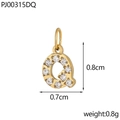 Macro detail of a gold letter Q pendant with dimensions 0.8cm by 0.7cm and sparkling zircon stones - Letter Q / Gold