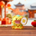 Resin lion figurine in yellow holding a lucky Fa character tile for car dashboard decor - Stone Lion Figure (3158)