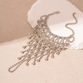 Macro detail of silver layered rhinestone tassel body chain on stone and sand background - Silver Multilayer Rhinestone Tassel (20# Silver Rhinestone)