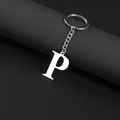 Polished stainless steel keychain with letter P pendant on black leather background - Letter P