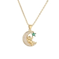 Detailed view of a gold-plated moon pendant with a cute bear and green star-shaped gem - Green