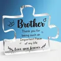 Macro shot of puzzle-shaped clear acrylic desktop ornament with heartfelt brother quote - Brother Blue Background Style (Q14)