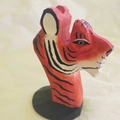 Handcrafted tiger wood glasses stand with orange and black stripes on a round base - Tiger
