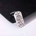 Macro shot of silver stainless steel dog tag keychain with engraved friendship message - Style 10 (Friendship Inspirational)