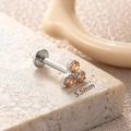 Titanium piercing stud featuring 5.5mm clover shape with three orange cubic zirconias - 5.5mm / Gold - Champagne