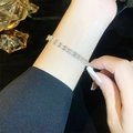 Elegant gold plated tennis bracelet featuring oval cubic zirconia stones on female wrist - Gold Oval Zirconia Bracelet (A2114)
