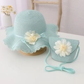 Close-up of light blue straw hat and matching floral bag with woven lace details - Hat + Bag Set / Mint Green