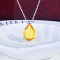 Elegant silver necklace featuring a pear-cut yellow gemstone pendant on a ceramic dish - Yellow Zirconia Pendant (No Chain)