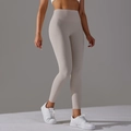 High-waisted skin-friendly yoga leggings in light oat grey with seamless elastic fit - Sandstone