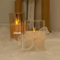 Warm LED electronic candle light in amber glass with white bow decoration, 10cm height - Transparent 10cm