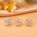 Detailed view of three flower stud earrings with marquise cubic zirconia in gold and silver - 9# Hexagon Flower