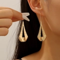 Golden geometric hollow earrings with hammered texture finish for a luxury look - Triangle Hammered (7581)