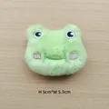Close-up of a plush green frog head accessory featuring embroidered eyes and 5x5.5cm size - Green Frog Head