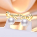 Sparkling zircon bow earrings with round white pearl drop on warm silk background - Gold Bowknot Pearl Stud Earrings (C7)