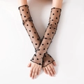 Detail of long black mesh gloves featuring retro polka dots and breathable lace material - Big Polka Dots