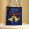 Close-up of Navy Christmas canvas tote bag featuring golden bell design and festive lettering - Style 51