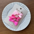 Set of 3 pink gradient grosgrain ribbon bow hair clips on a white ceramic plate - Bright Pink Series
