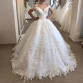 Elegant white off-shoulder lace wedding dress featuring 3D floral appliques and a long train - US 8 / White