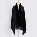 Detailed view of winter black faux fur shawl featuring long fur collar and fringe tassels - Black