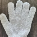 Exfoliating bath glove in white frosted texture on a rustic wooden background - White