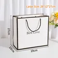 Minimalistische große Geschenktüte in Weiß mit Best Love Aufdruck und Kordelgriff - Groß / Weiß
