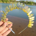 Detail of wire-wrapped yellow crystal points and metal moon on a handmade crown headband - AB Yellow