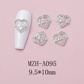 Macro view of silver heart-shaped nail charms with Love engraving and small rhinestones - Silver Heart LOVE Engraved Style (A095)