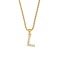Macro detail of golden letter L pendant necklace with zircon and twisted rope chain - Letter L