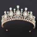 Close-up of golden bridal tiara featuring light blue teardrop crystals and clear stones - H1380 KC Gold White Diamond + Green Opal