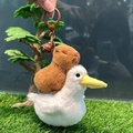 Cute capybara plush keychain riding a white duck with a brown bell and metal ring - Riding Pelican