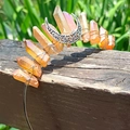 Detail of handmade bohemian crown with orange crystal clusters and silver moon pendant - Milk Tea Color Crystal with Silver Wire & Moon