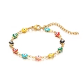 Golden stainless steel evil eye bracelet featuring vibrant multicolor enamel eye charms - Colorful