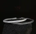 Zilveren Mobius armband met pijlweefselstructuur op zwarte lavasteen - Mobius Antiek Zilver