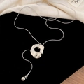 Detailed view of silver Y-shaped snake chain necklace with irregular organic pendant - Silver