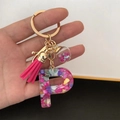 Close-up of resin letter P keychain with pink tassel and glitter ball held in hand - Small Ball Tassel Clasp / Letter P