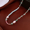 Detail of colorful beads with freshwater pearls and shoushan stone on brown fabric background - Necklace / Blue