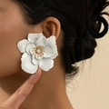 Elegant white petal earrings with layered floral design and a sparkling gold stamen center - White