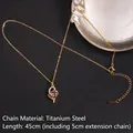 Golden heart necklace with purple zircon and love engraving on black leather background - Hollow Heart LOVE Style (Purple Zirconia No. 25 A904)