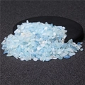 Polished irregular light blue and white natural crystal gravel on a black mat - Aquamarine / 5-7mm 100g