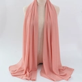 Lightweight coral pink chiffon hijab scarf made of breathable polyester fabric on mannequin - 47