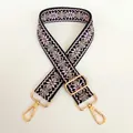 Detail of 3.8cm wide woven canvas strap with pink diamond patterns and gold metal clips - Black Pink Gold Hook